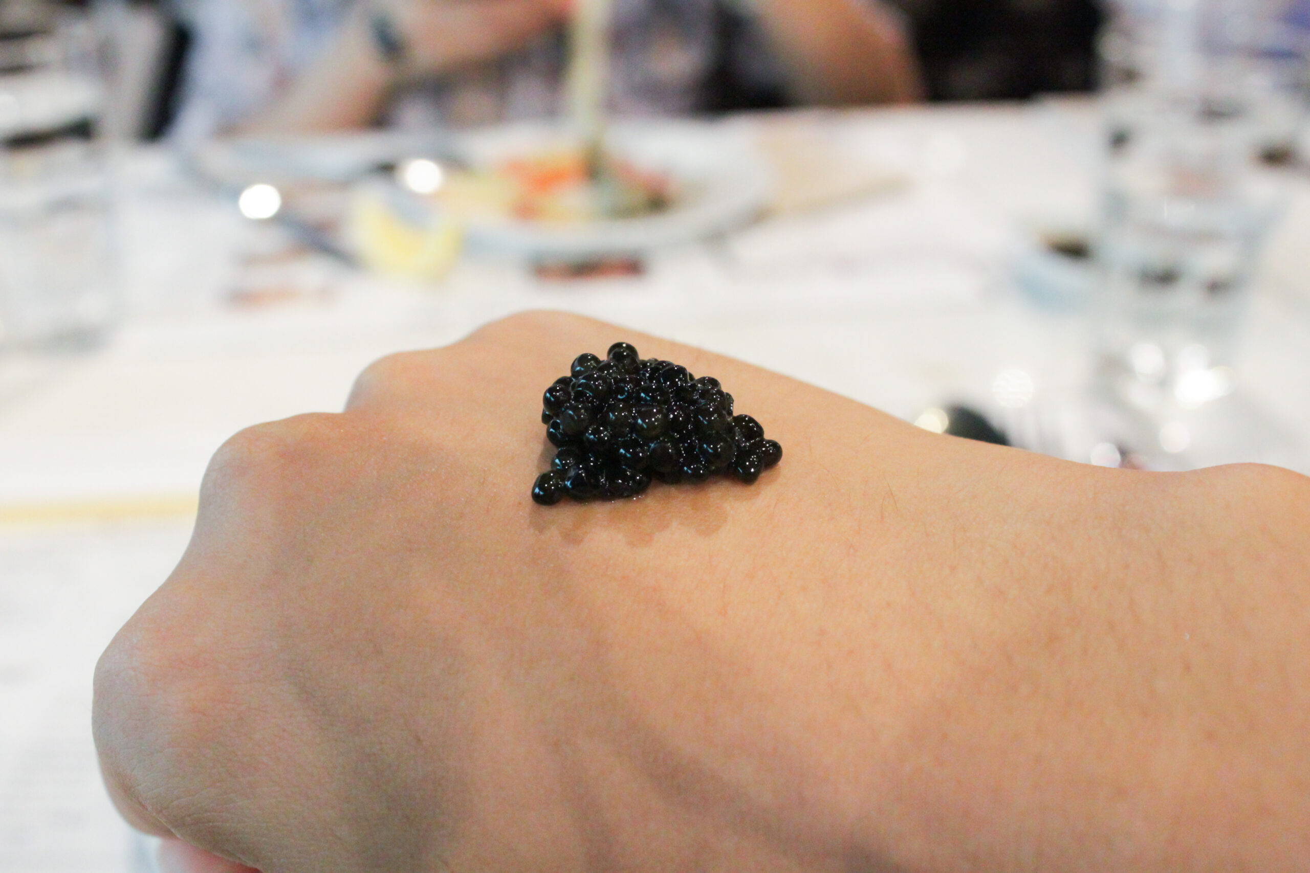 caviar placed on hand back