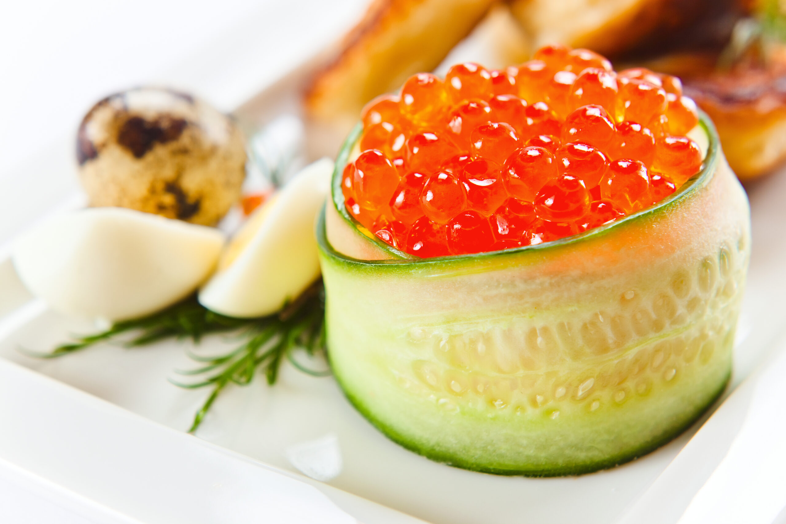 macro shot of red caviar with pancakes